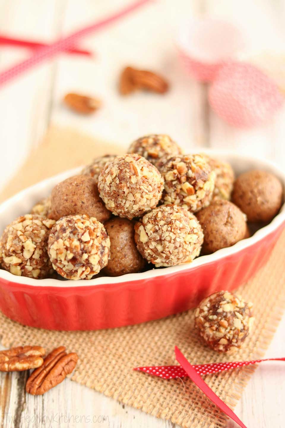 Easy no-bake holiday treats! These delicious Gingerbread Date Balls take just minutes to make! They’re filled with yummy, holiday gingerbread spices - indulgent enough for holiday desserts or for pretty Christmas cookie trays, yet nutritious enough for a healthy snack! No guilt in these little indulgences! Bonus: since this date ball recipe is so quick and can be made ahead and frozen, it’s perfect for last-minute, homemade DIY gifts, too! Can be made nut-free. | www.TwoHealthyKitchens.com