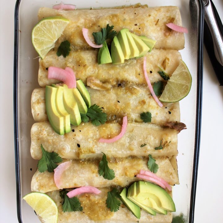 Dairy Free Chicken Enchiladas with avocados, pickles onions, and cilantro birds eye view