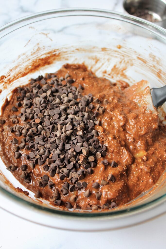 Mixed healthy chocolate banana bread batter with chocolate chips added 