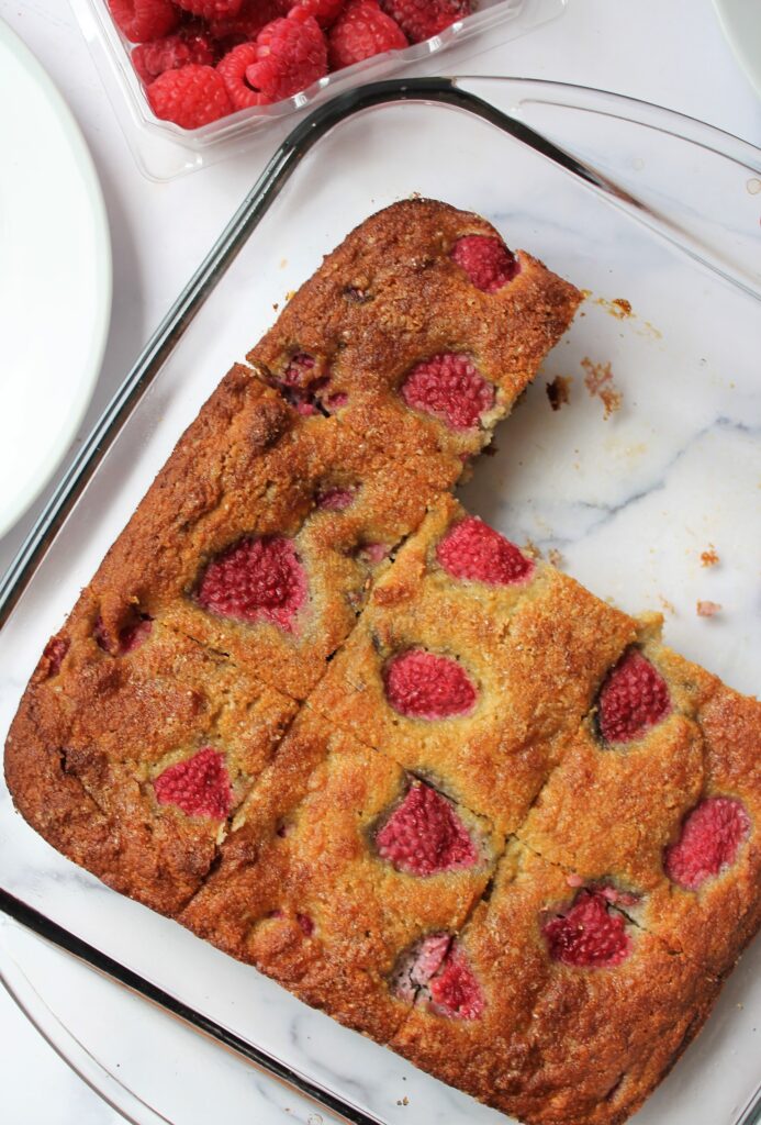 overhead shot of healthy raspberry summer cake in a pan